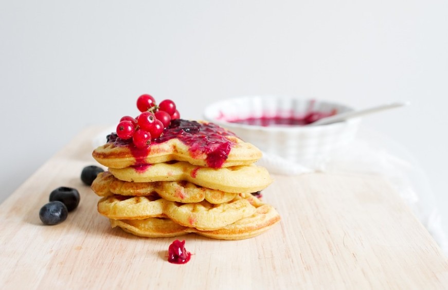 waffles with mixed berry toppings, red currant syrup