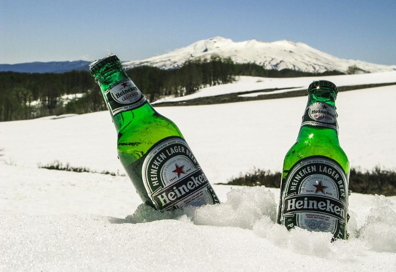two bottles of Heineken drink in the snowy mountain