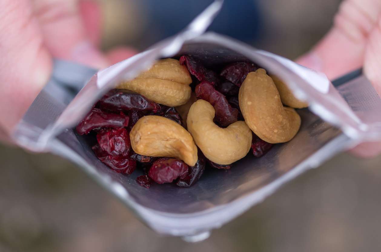 a pack of dried fruits, cashew, and cranberries