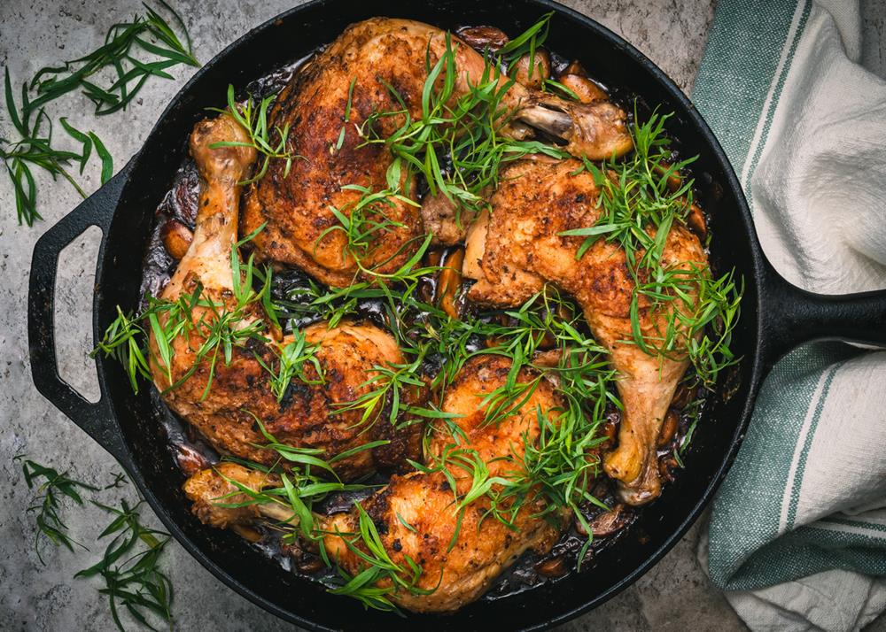 Chicken chasseur with fresh taragon in cast iron skillet